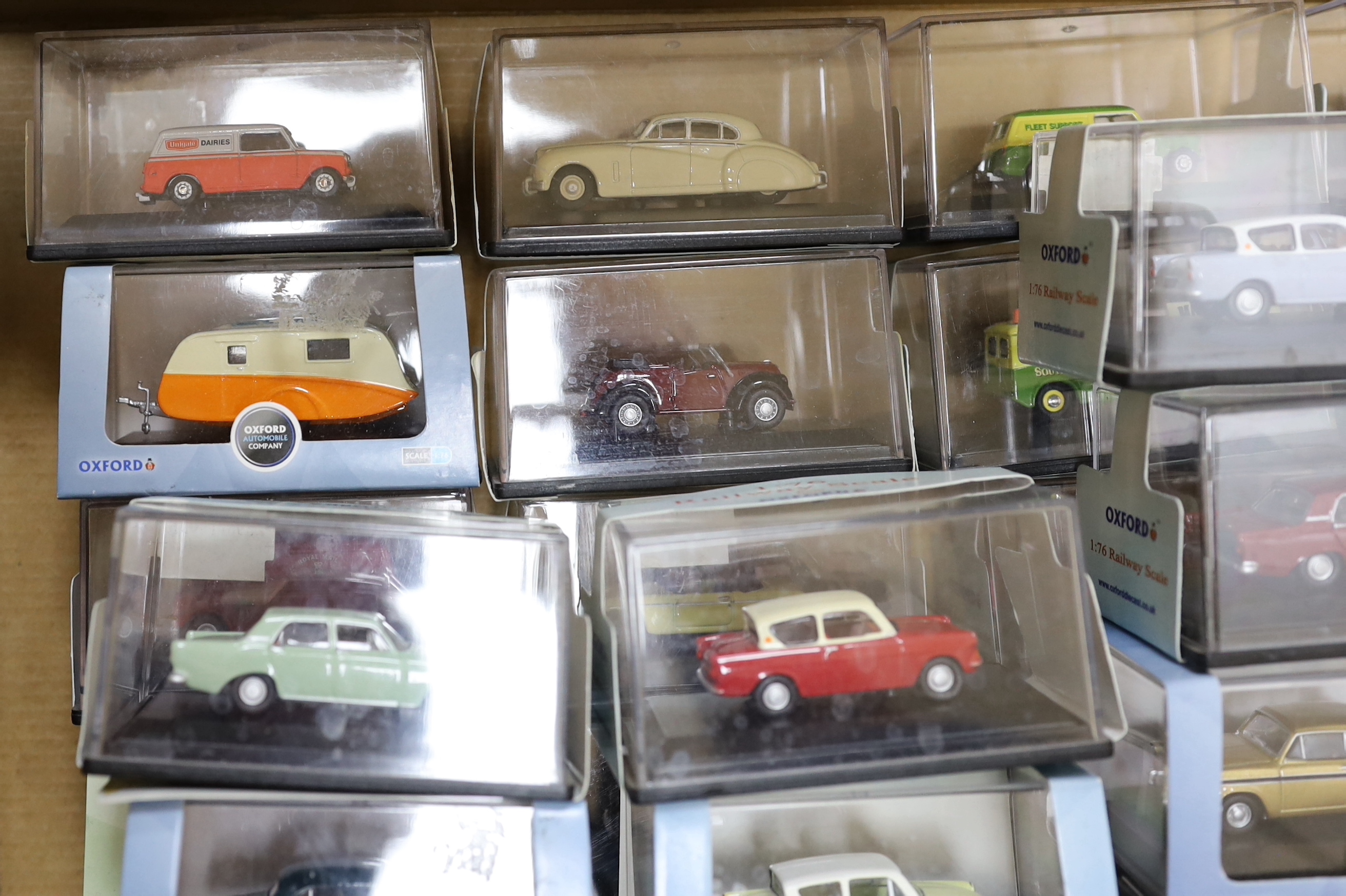 A collection of boxed 00 gauge 1:76 scale vehicles by Oxford Diecast and Corgi, including mainly 1950s/60s/70s cars and light commercial vehicles (54)